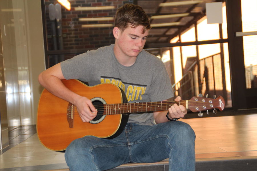 Sophomore Justin Mabry plays the guitar.