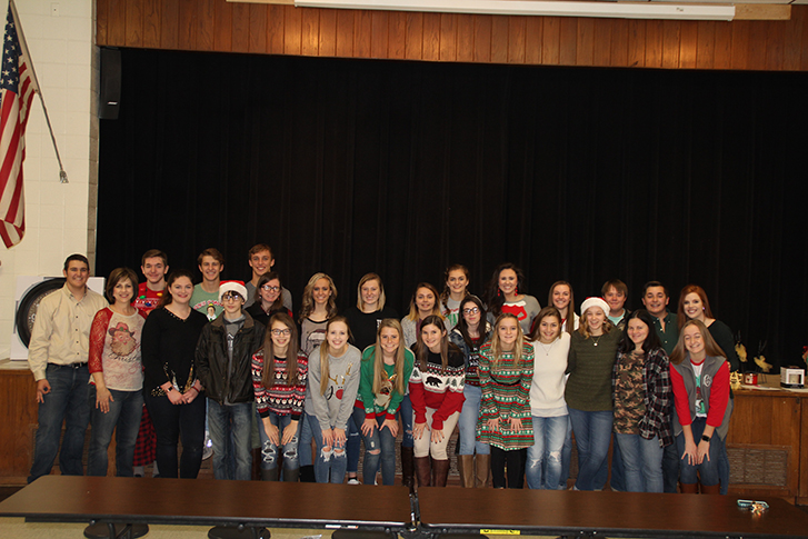 The NHS poses for a picture before their Christmas luncheon.