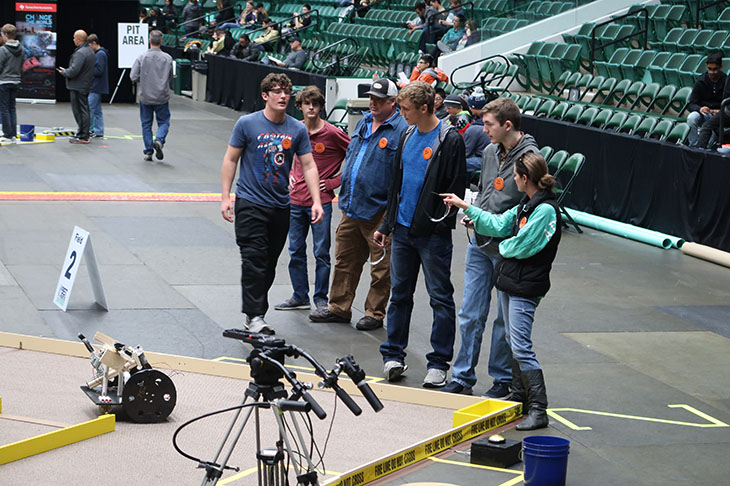 The robotics team lines up before their competition.