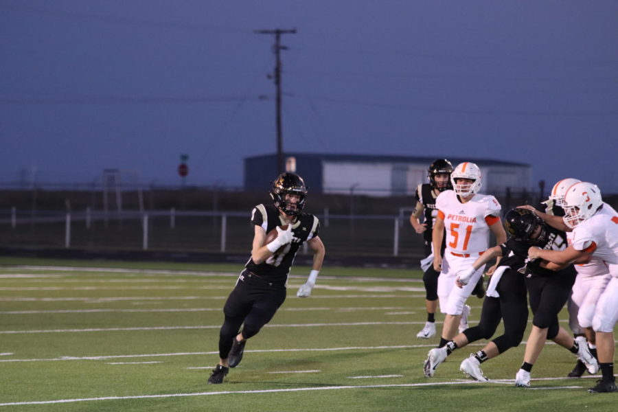 Senior Conner Byrd runs the ball in the Wildcats 62-7 win over Petrolia