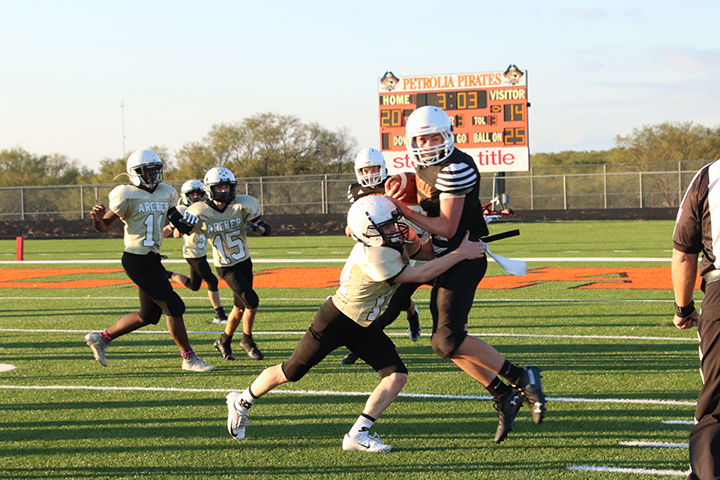 Tackling the other player as he runs to the in zone 