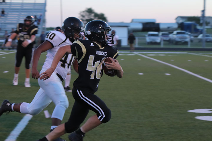 Hunter Sims runs the ball against Haskell