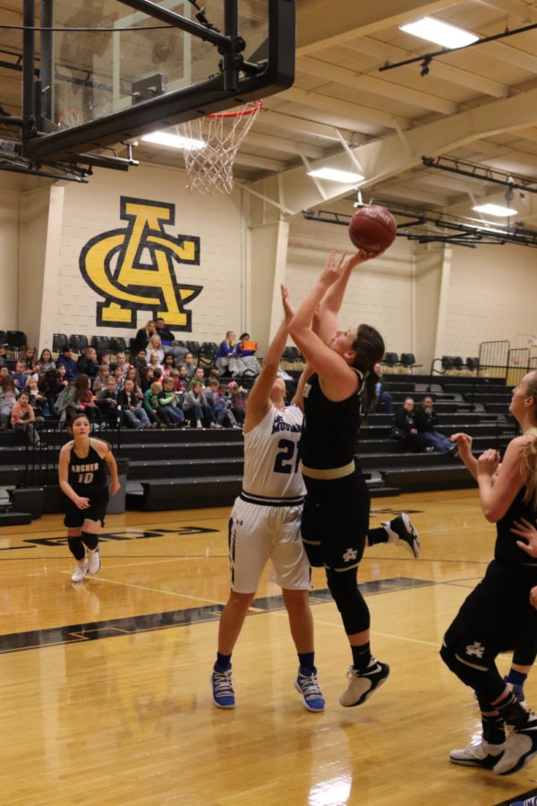 During last weeks Wildcat Classic, junior Shaylee Watson goes up for a layup while junior Maggie Coates prepares to assist. The Ladycats defeated City View in the first game of the tournament.