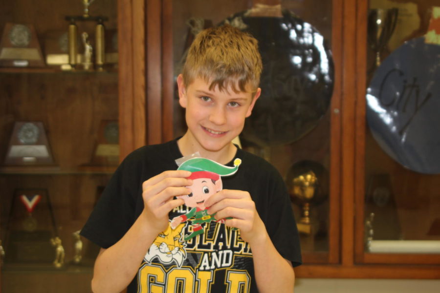Seventh grader Jesse Pulley shows off Buddy the Elf that he found the first week of the Student Council game.