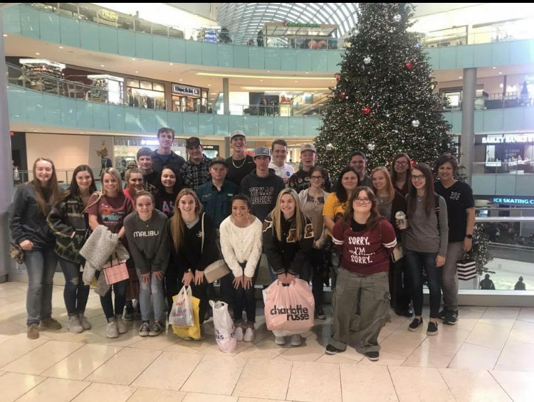 NHS poses in front of the Christmas tree at the Galleria Mall. The group also saw A Christmas Carol.