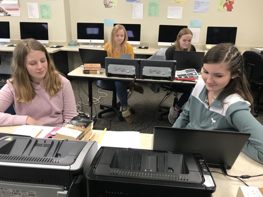 Brooke Rice, Emily Strenski, Tessa Brooks, and Breanna Howard prepare to write editorials at the invitational UIL meet hosted at Archer City. The journalism team took first place at the meet.