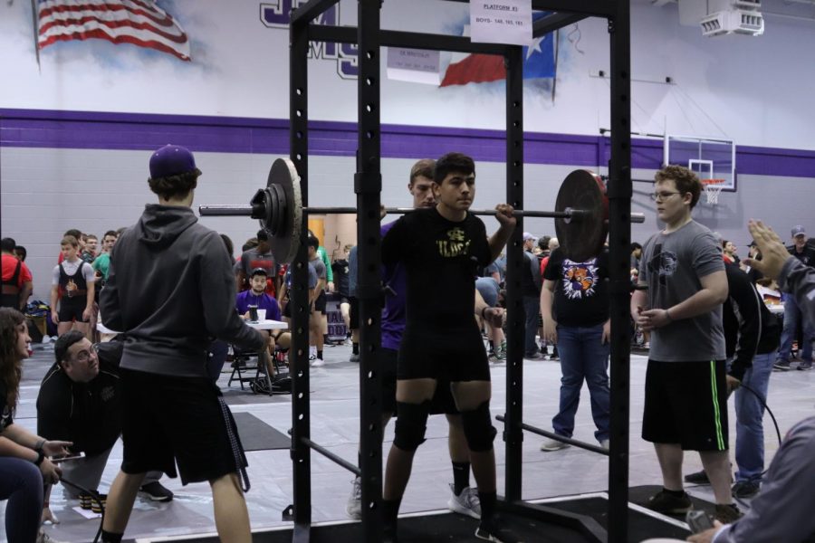 Freshman+Christopher+Allen+prepares+to+squat+during+the+meet.