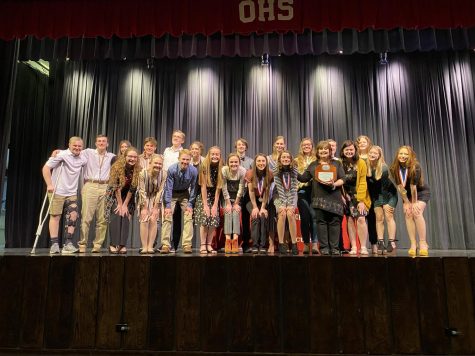 The OAP cast and crew accept their plaque to advance
