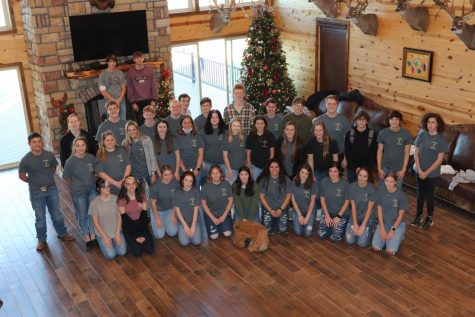 NHS members pose in the hall at V-Tex Ranch.