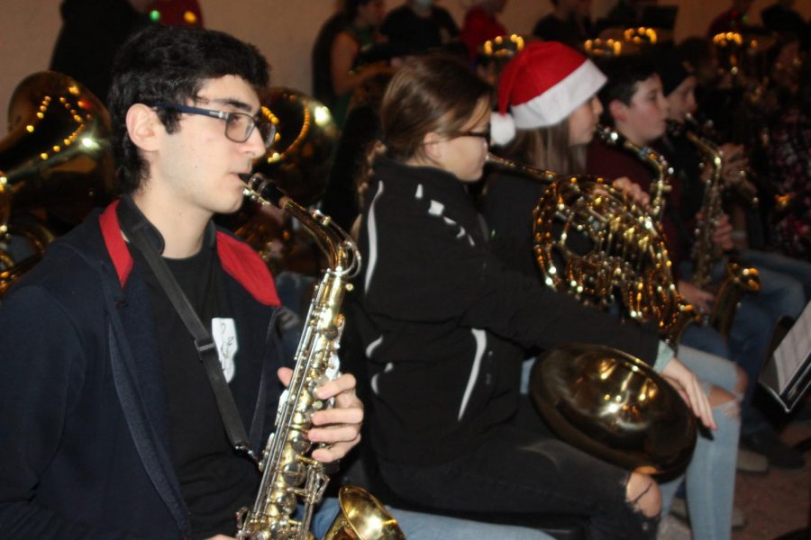 At Christmas on the Square Dec. 2, Emily Anderson, Jocelyn Tedrow, Grayson Jeter, and Ty Cantrell play "Jingle Bell Rock." The junior high and high school bands played together.