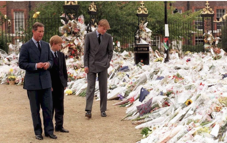 Charles and his children Harry and William visit the multitudes of floral tributes and mourn Dianas death.