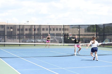 Senior Sara Schroeder and junior Kline Mayo compete in a mixed doubles match.