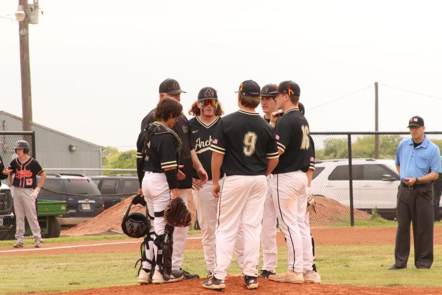 The Wildcats in a time-out talking with Coach Kent Kyle by Zoey Bates