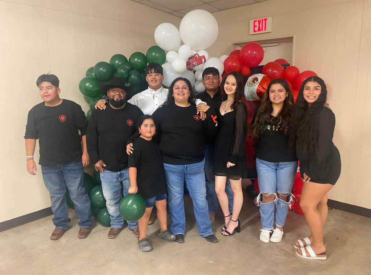 The members of the Carrera/Guerrero family (along with one sibling’s girlfriend) gather together.  The family has six children with three girls and three boys.