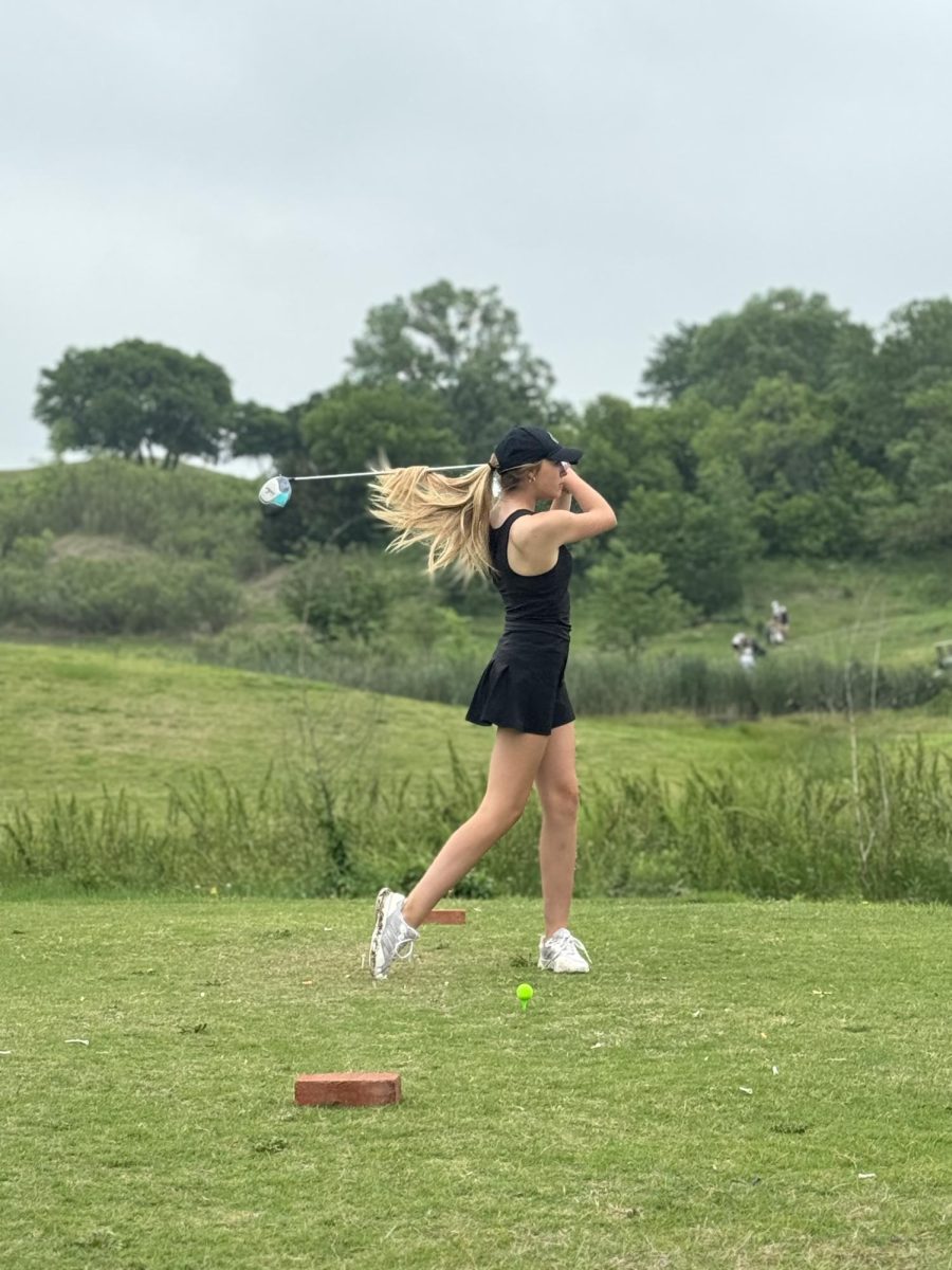 Maria Gonzales practices her swing to prepare for an important shot