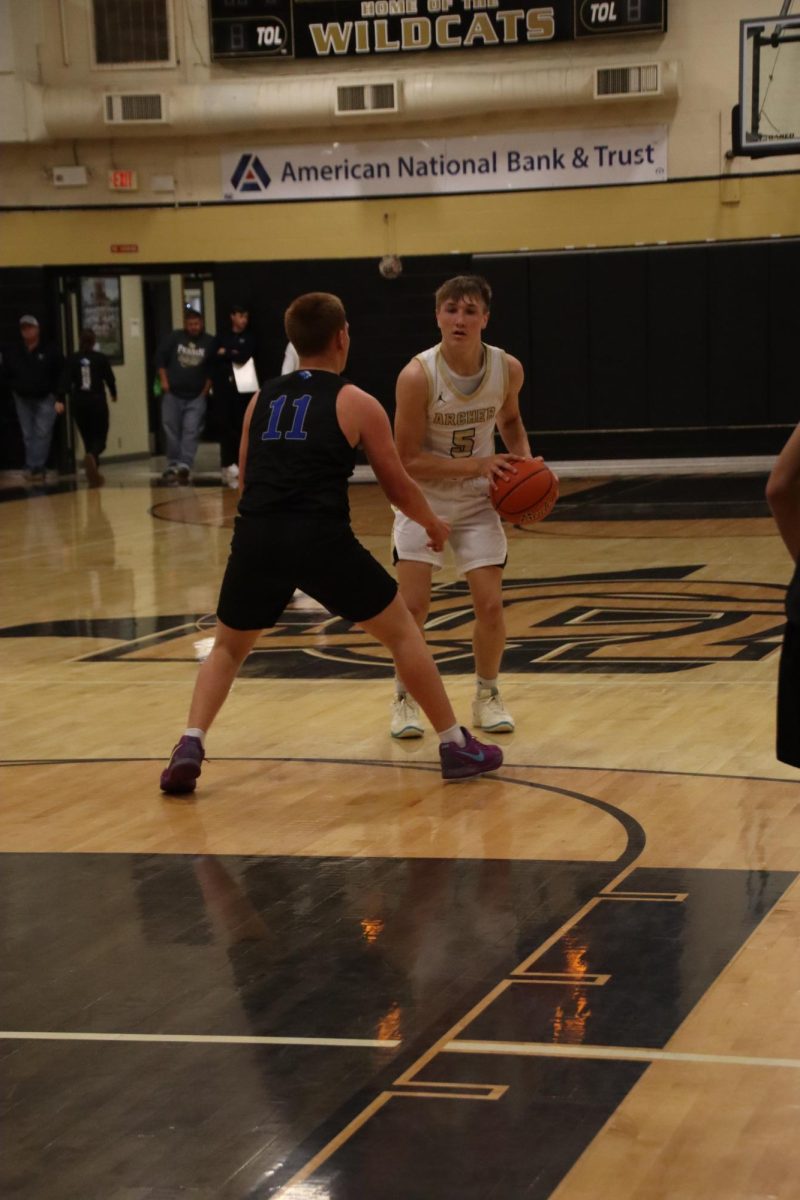 Senior Landon Smith brings the ball up the court.