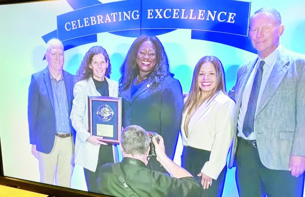 Superintendent Jon Hartgraves, Elementary Principal Amy Huseman, Elementary Counselor Vicky Lopez and former superintendent C.D. Knobloch receive the Blue Ribbon Award in Washington, D.C. Students watched the national ceremony which was live streamed.