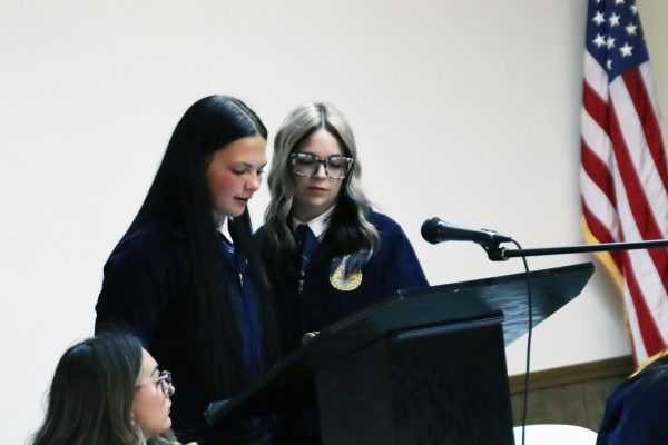 Senior Victoria Foster, junior Brilee Canada and senior Zoey Bates speak at the FFA banquet on May 5. 