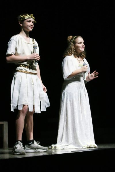 Eighth grader Teegan Bumgarner and seventh grader Zerah Ridenour introduce the play as narrators.